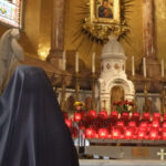 Praying for our benefactors in front of the miraculous image of Our Lady in Boston